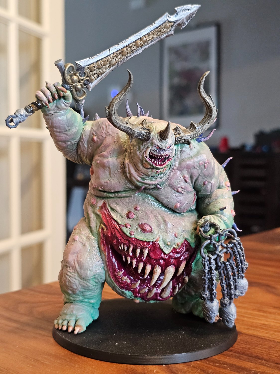 Hand-painted bloated plague daemon with a giant blade